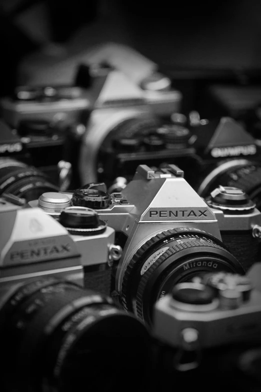 an array of cameras in black and white