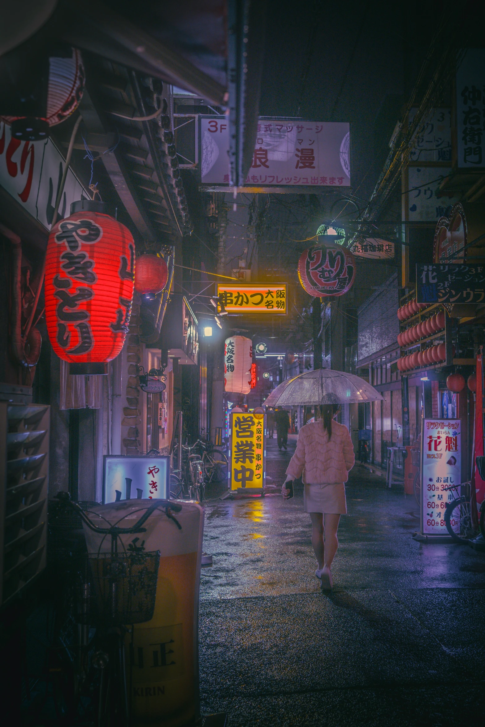 a woman walking in the rain with an umbrella