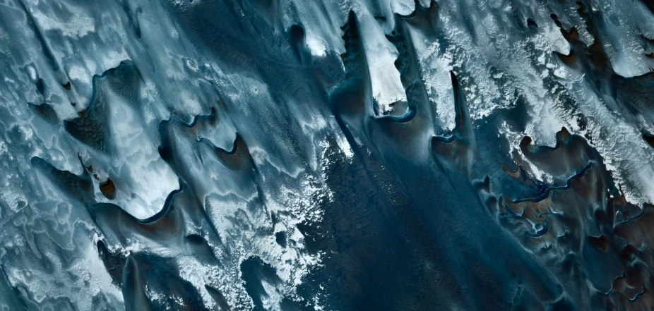a beautiful aerial s of ice formations at the bottom of water