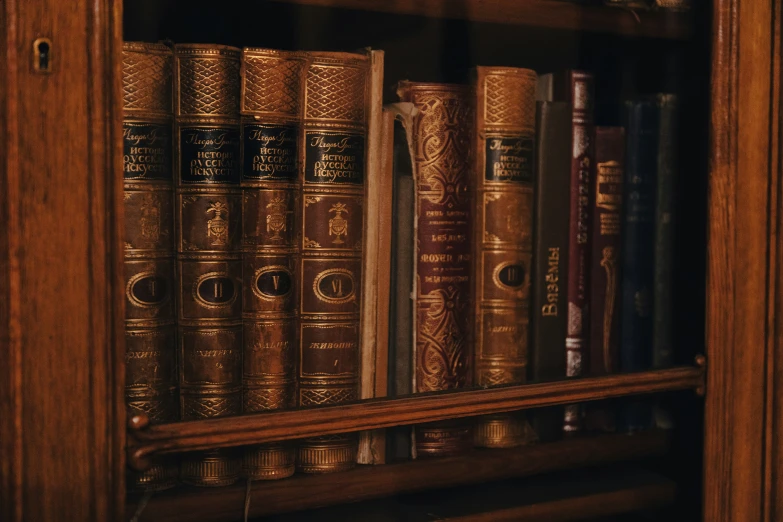 an old wooden bookcase with some books inside