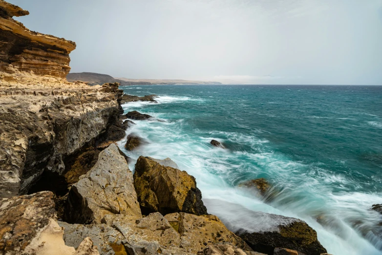 water and rocks near an ocean with a rocky shoreline