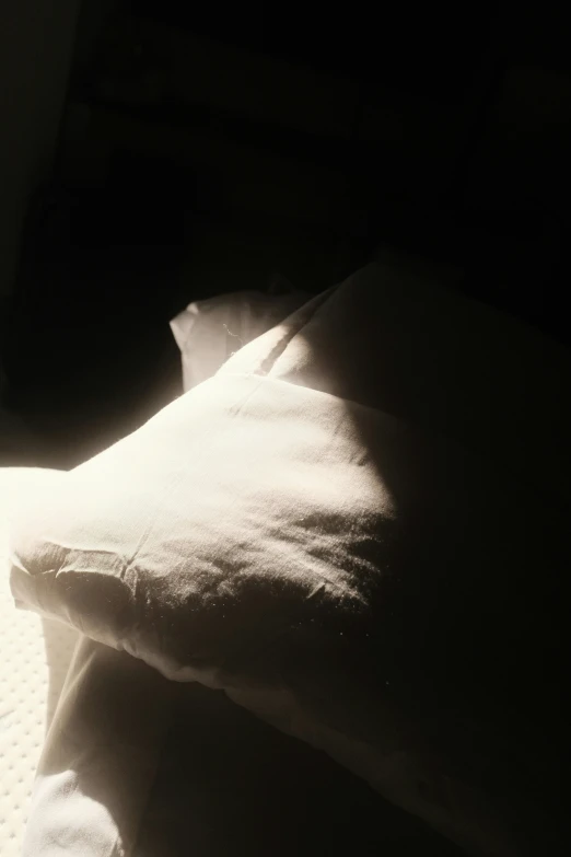 a blurry po of a bed in the sun