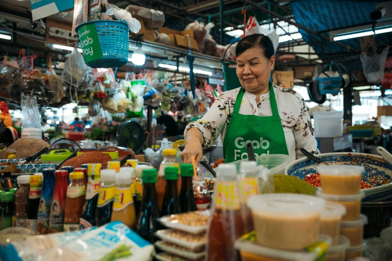 a woman that is standing in front of a counter