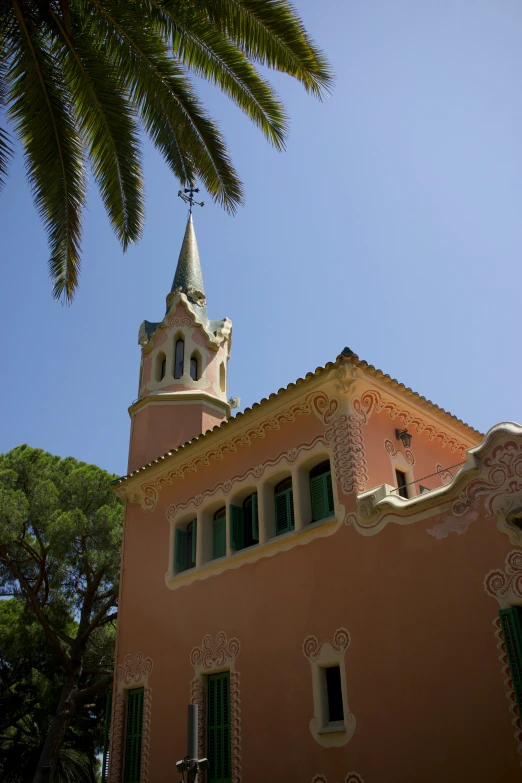 an orange building with a clock tower under a blue sky