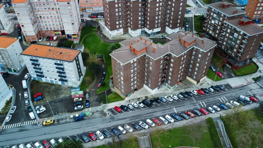 a group of large brick buildings next to a road