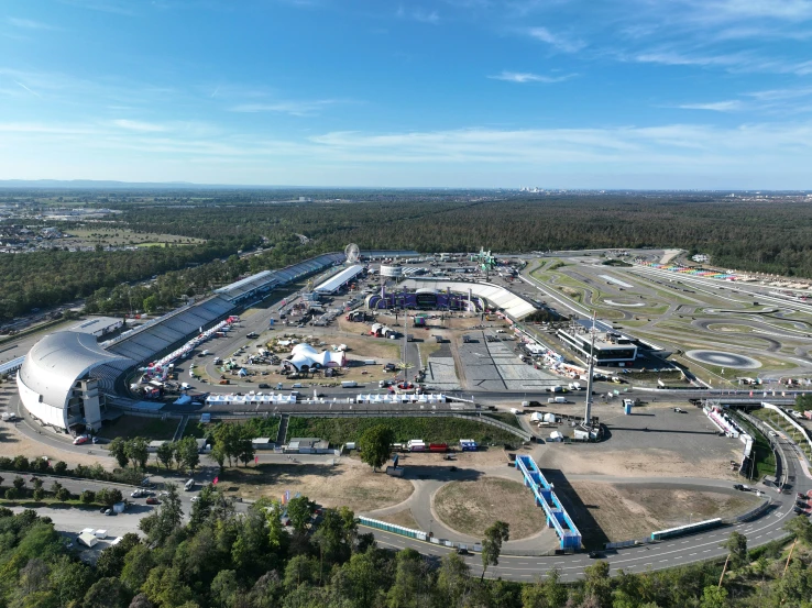 a large construction site with an oval shaped building in the middle