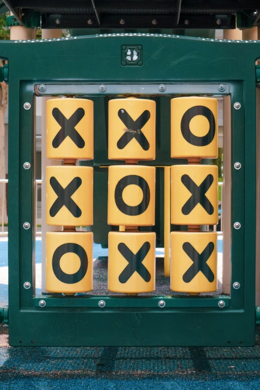 a tic - tac - toe game sits on a sidewalk