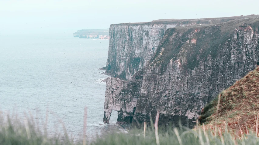 there is an over head view of cliffs near the water