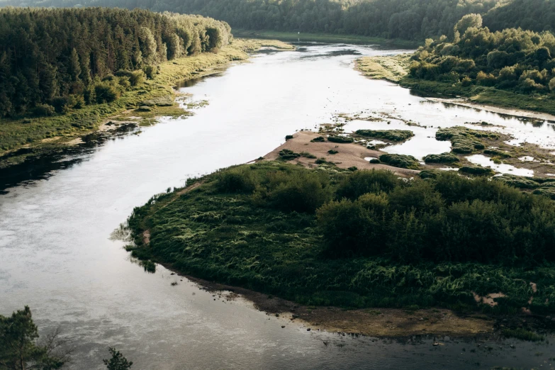 there is an aerial view of a river that runs through a forest