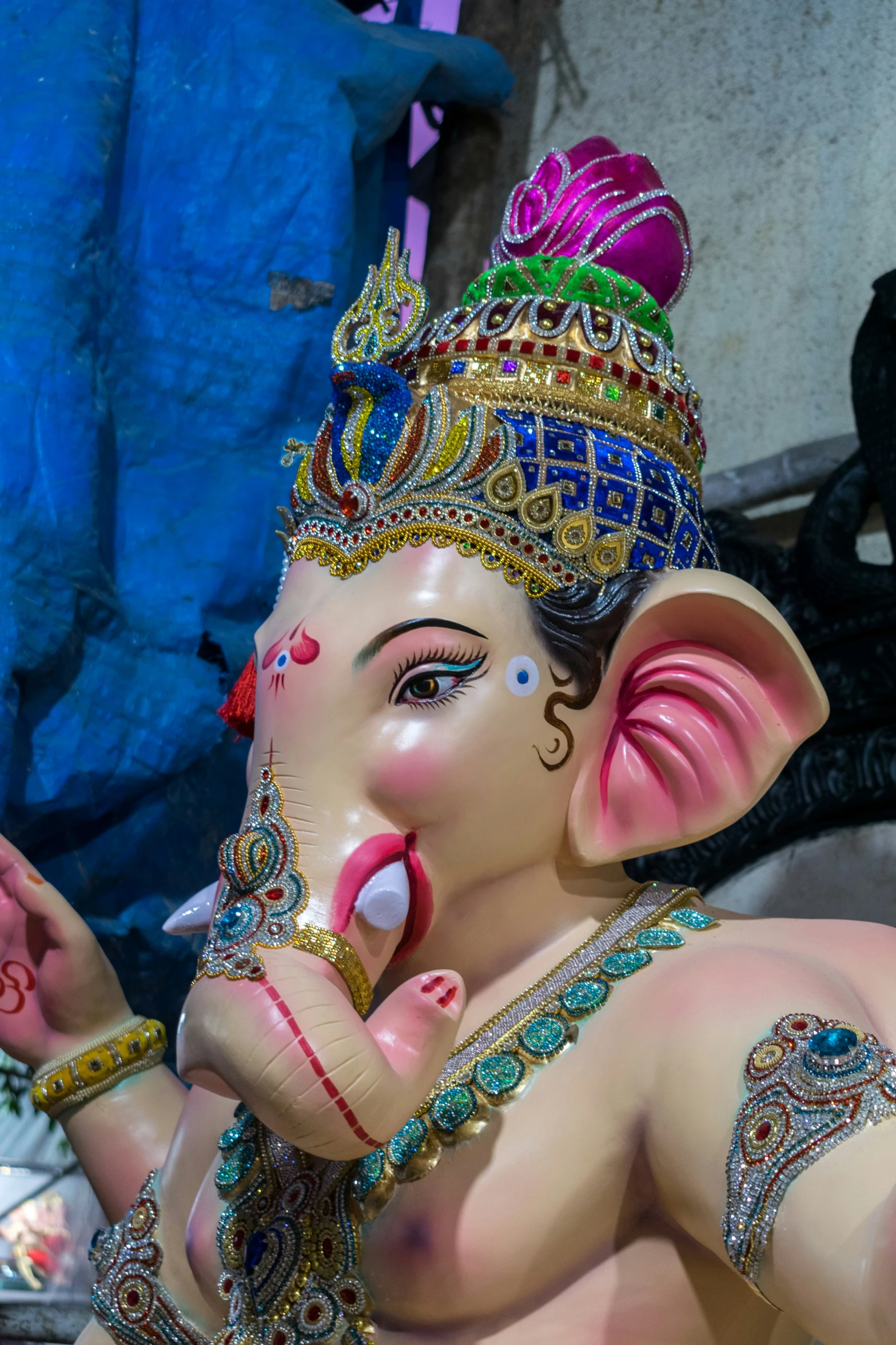 a statue of an elephant wearing a headdress