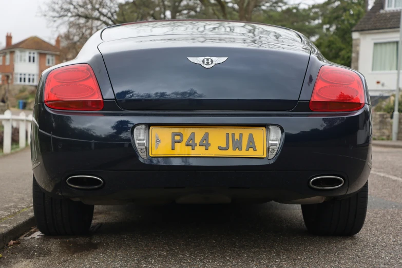 a car with an old license plate showing the number of its cars