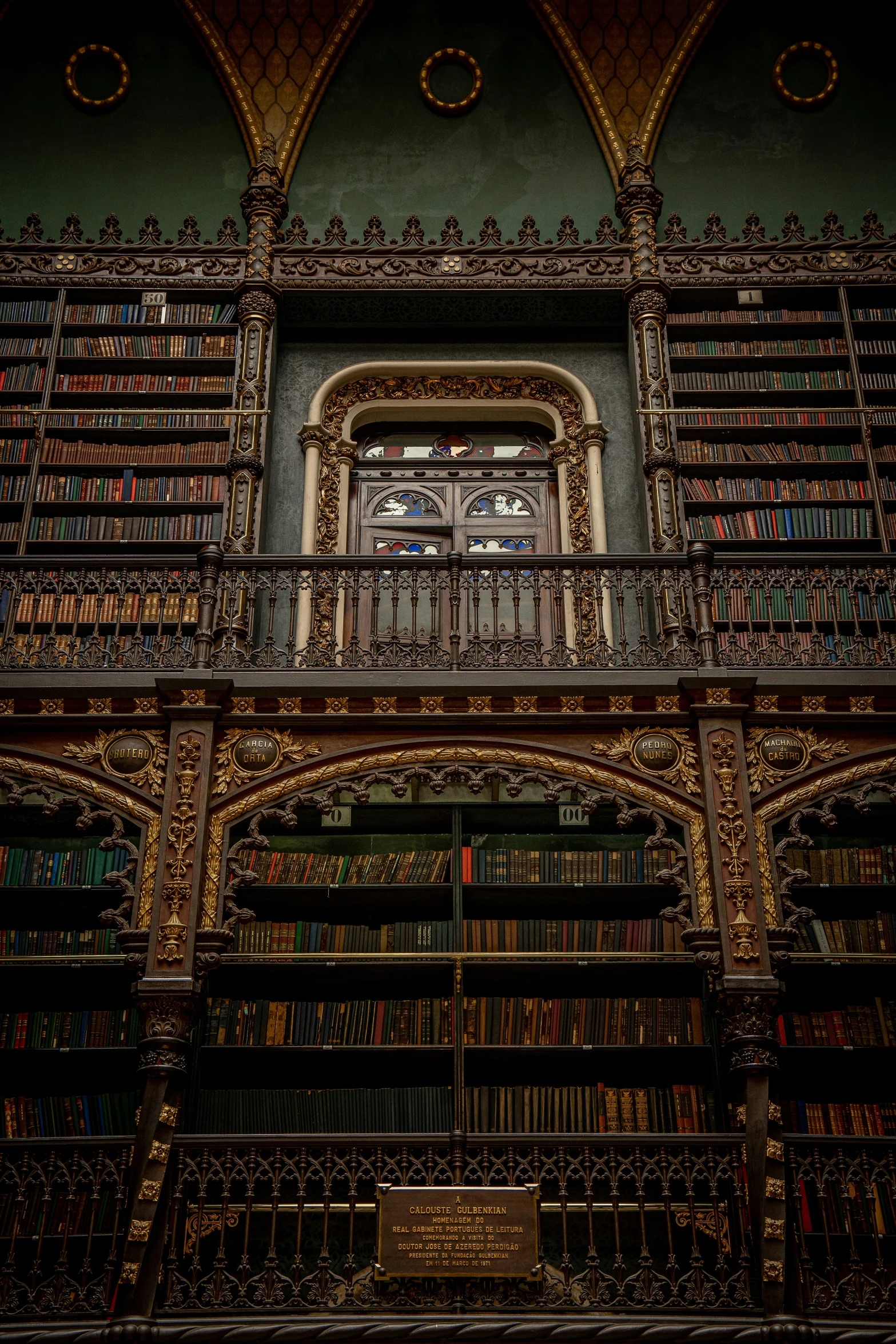 a building filled with lots of books sitting under tall ceilings