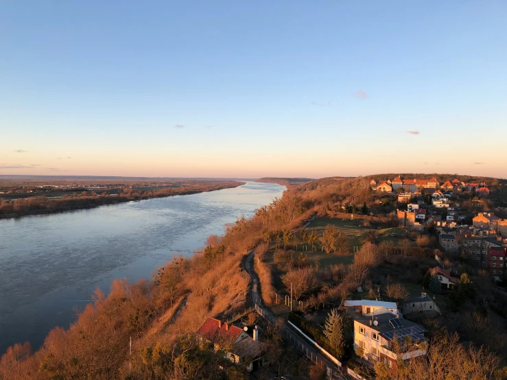 an overview of a small town and its river