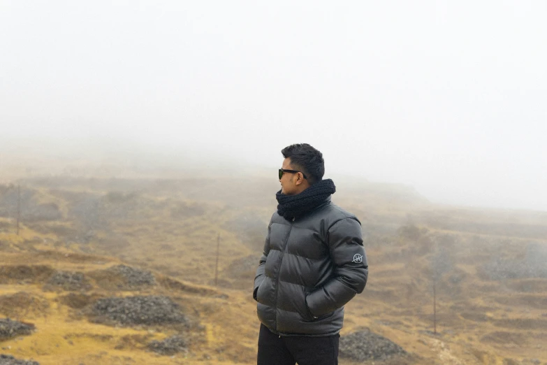 a man stands in front of the fog