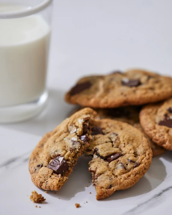 several chocolate chip cookies and a glass of milk