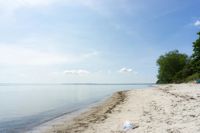 the view of the shoreline along the beach from the shore