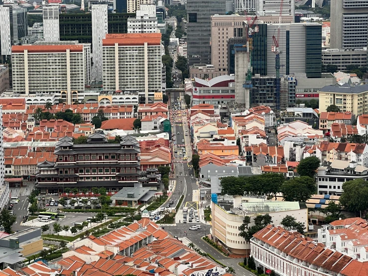 an aerial view of a city with red roofs