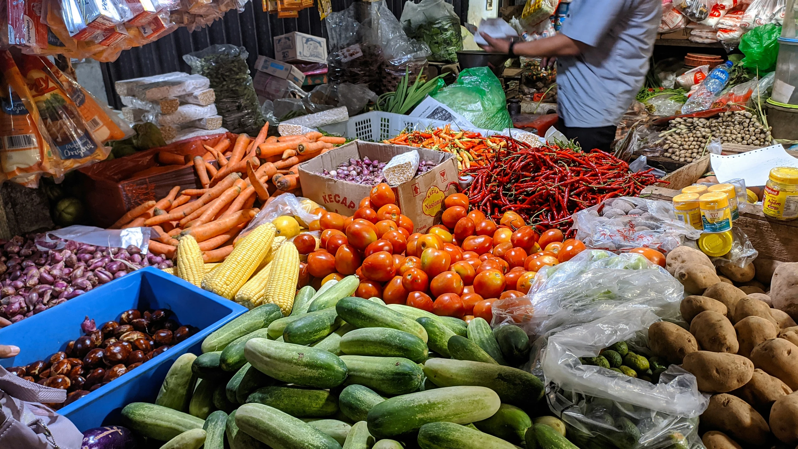 a farmers market with an assortment of fruits and vegetables