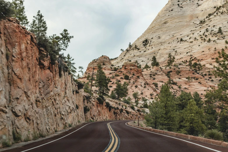 a road going through the middle of some mountains