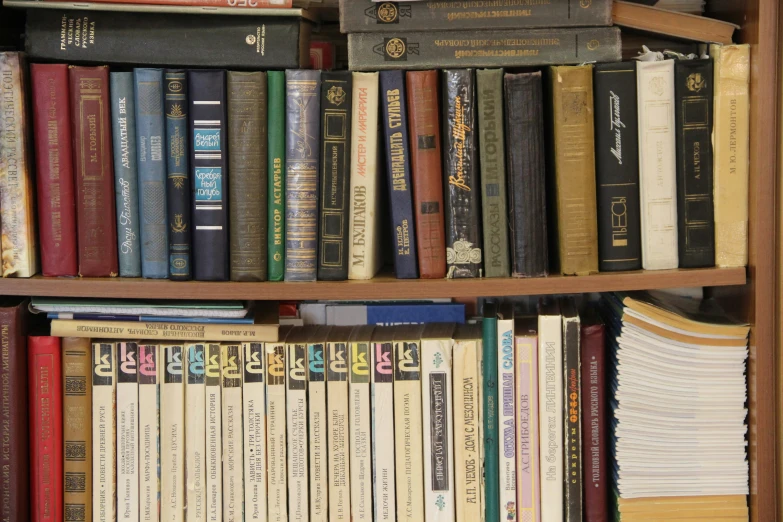 a bookcase is full of books that are old