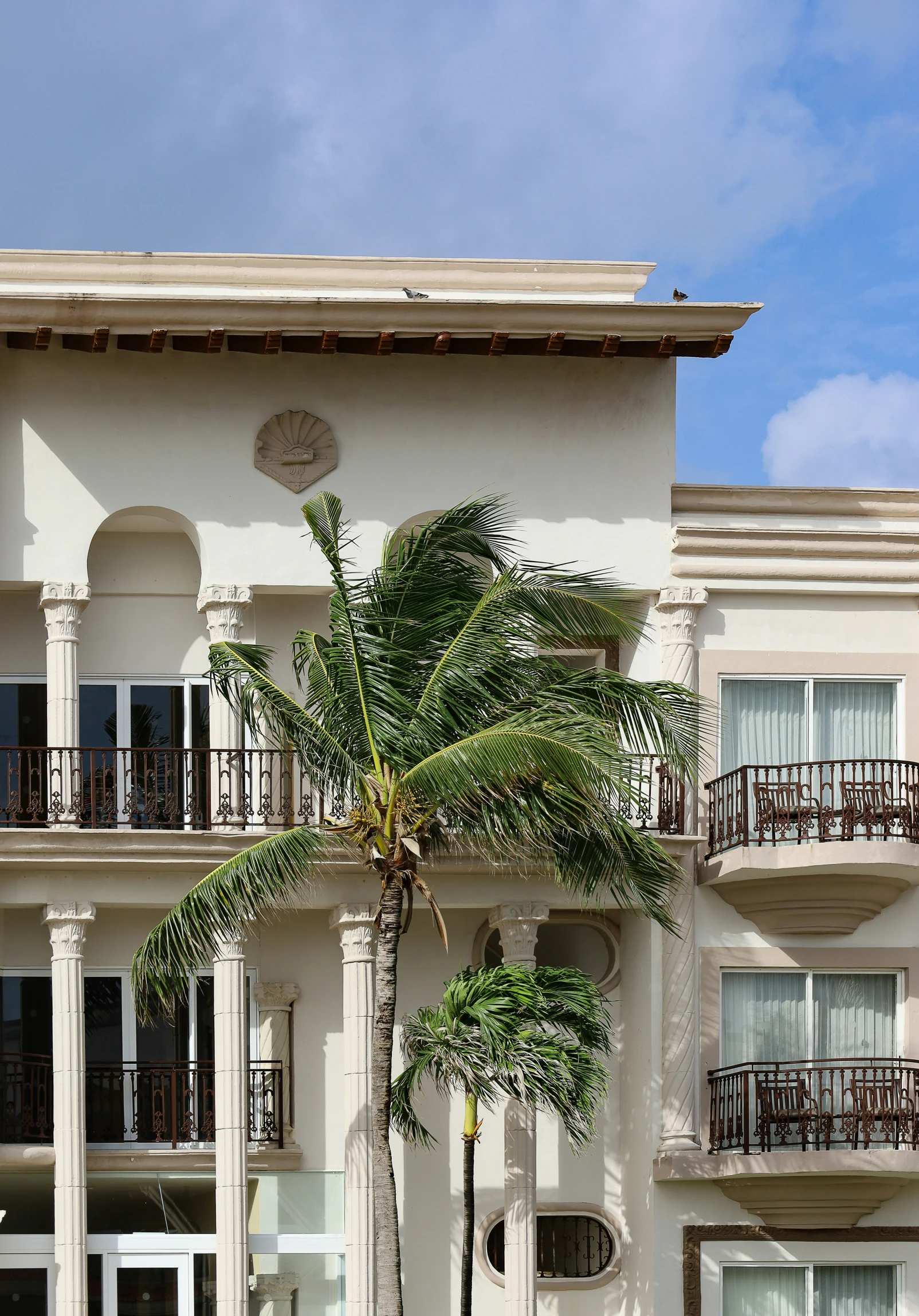 a very tall building with many balconies on it