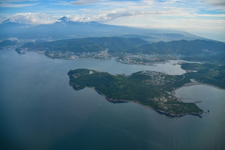 a small island nestled between the mountains near water