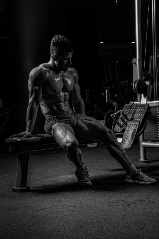 a shirtless man in his underwear sitting on a bench