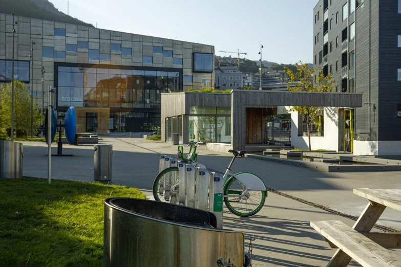 an artistic building surrounded by trees and buildings