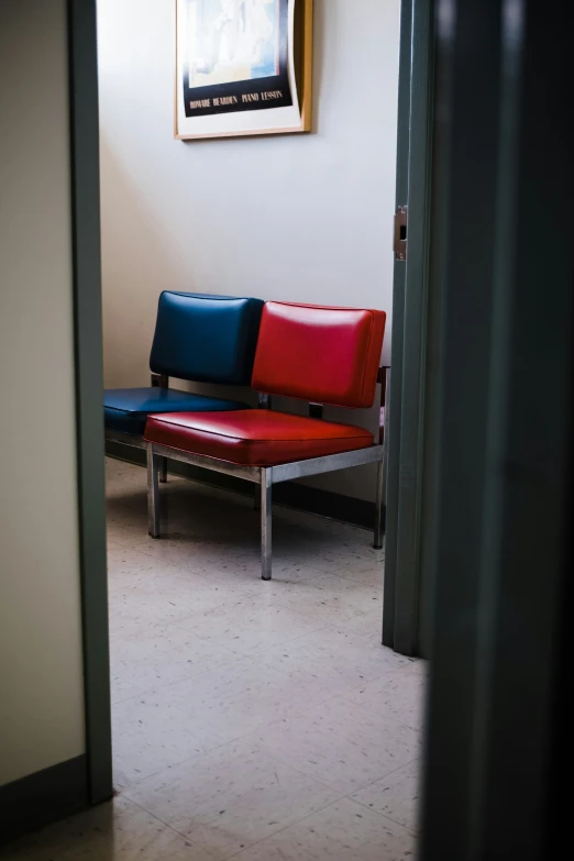 a po with blue and red on a corner with a couch