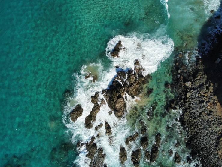 the water and the rock formations in the middle of the ocean