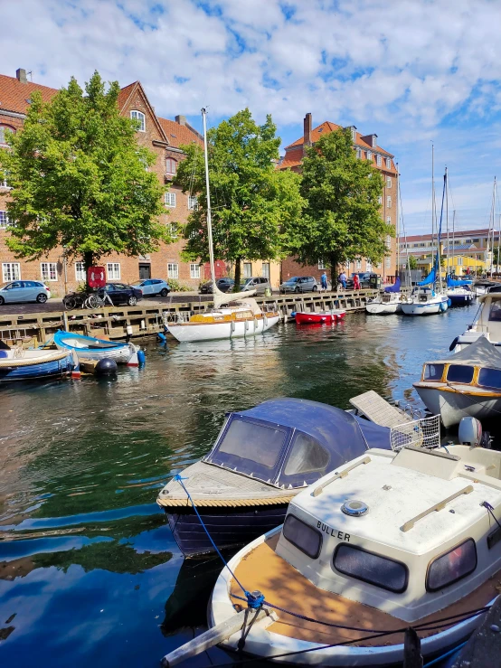 several boats are parked at the marina of a harbor