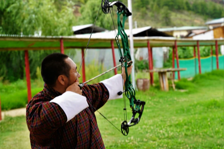 an image of a man that is practicing archery