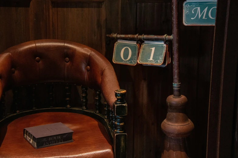 an old wooden chair next to two signs