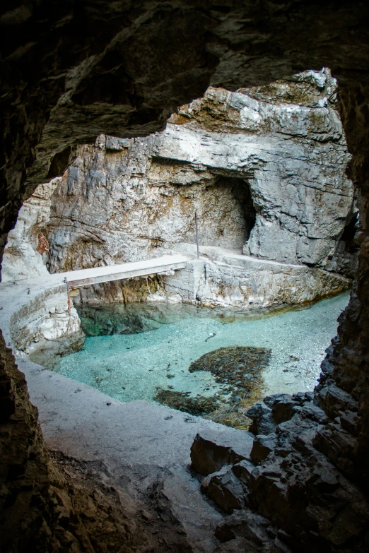 a pool in a cave with several steps going up