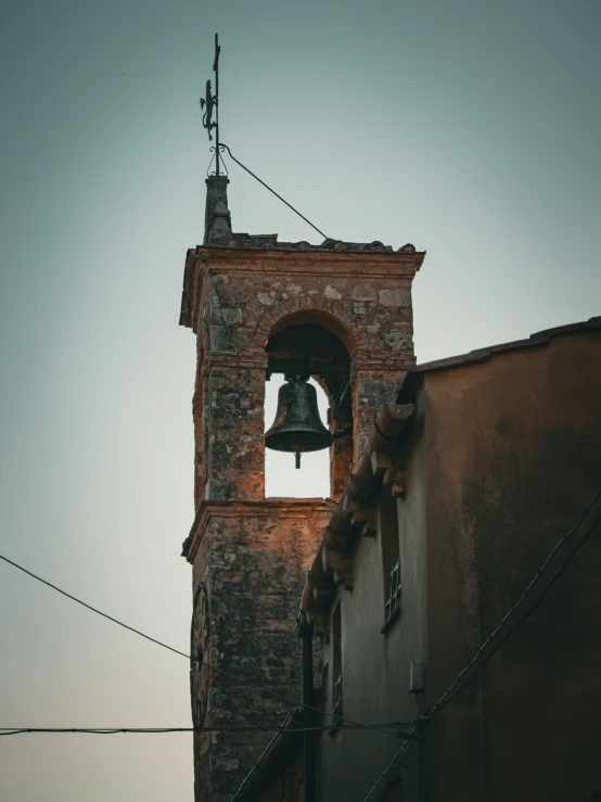 a bell tower is shown next to a building