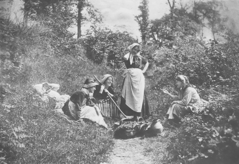 a vintage black and white po of a woman standing in the woods