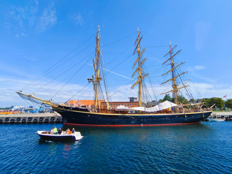 an old - fashioned sailing ship is sitting in the water