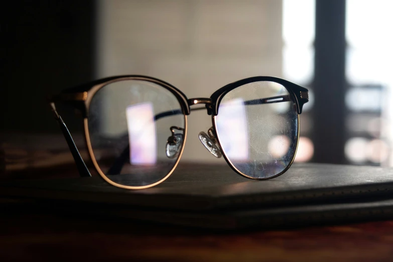 two glasses are sitting on top of a book