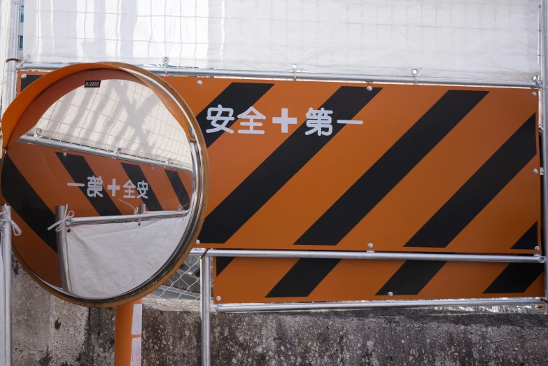 some street signs with asian characters written in human language