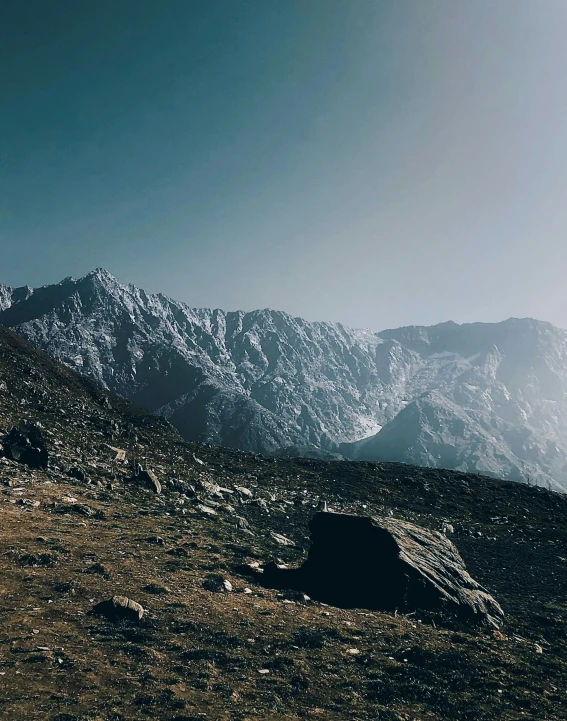 the rocky outcropping of a mountain near the sky