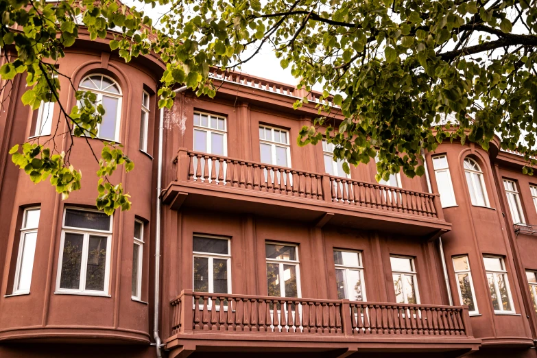 a tall building with lots of windows and balconies