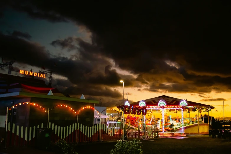 there is a carnival on the street at night