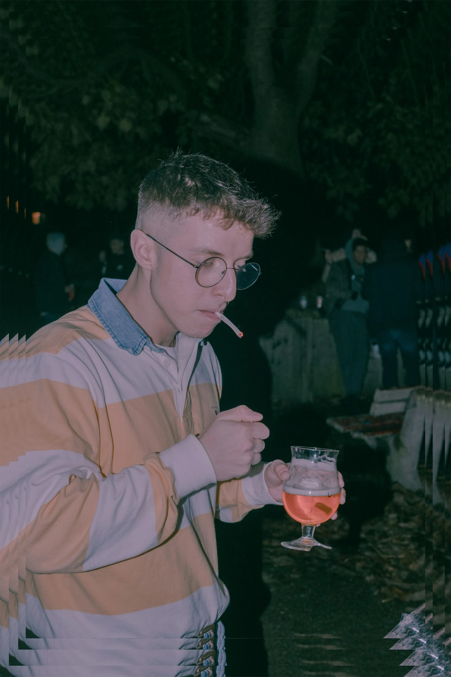 the young man is standing with his mouth open and holding a cigarette in hand