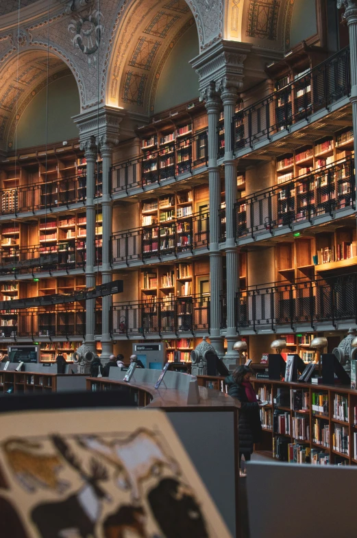 a room with many books and people in it