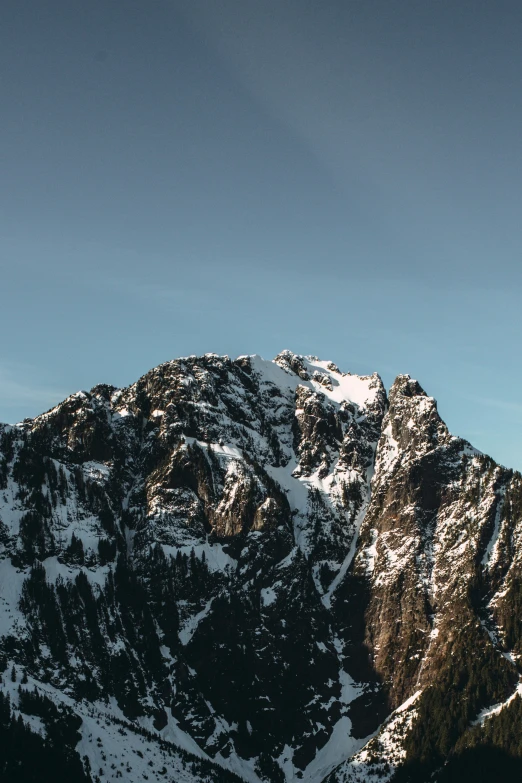 the view from a snow covered mountain shows the mountains