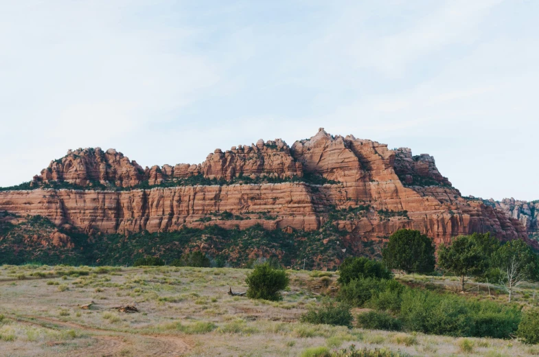 the mountains are very large and red on their sides