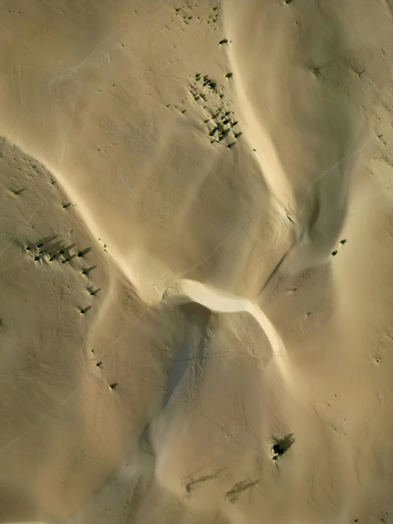 a desert landscape with the sand being covered with sand