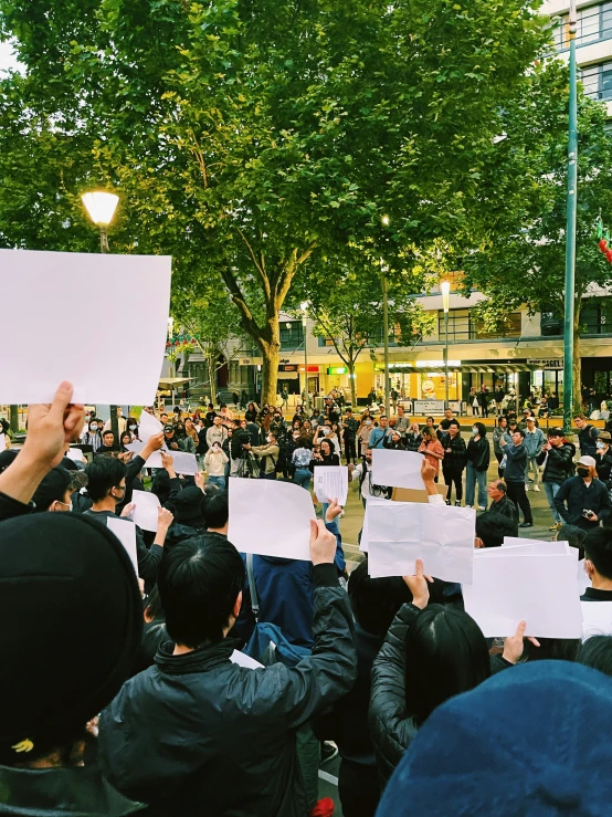 there are many protesters that are holding up signs