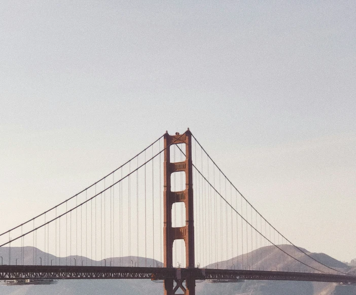the golden gate bridge towering over a body of water