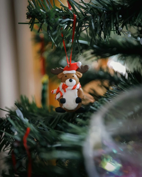 a christmas ornament hanging from the tree